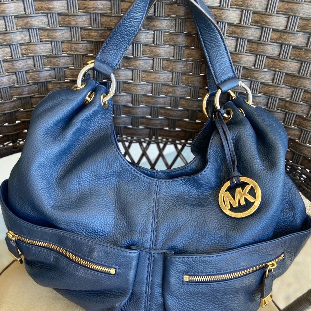 Blue Michael Kors shoulder bag.